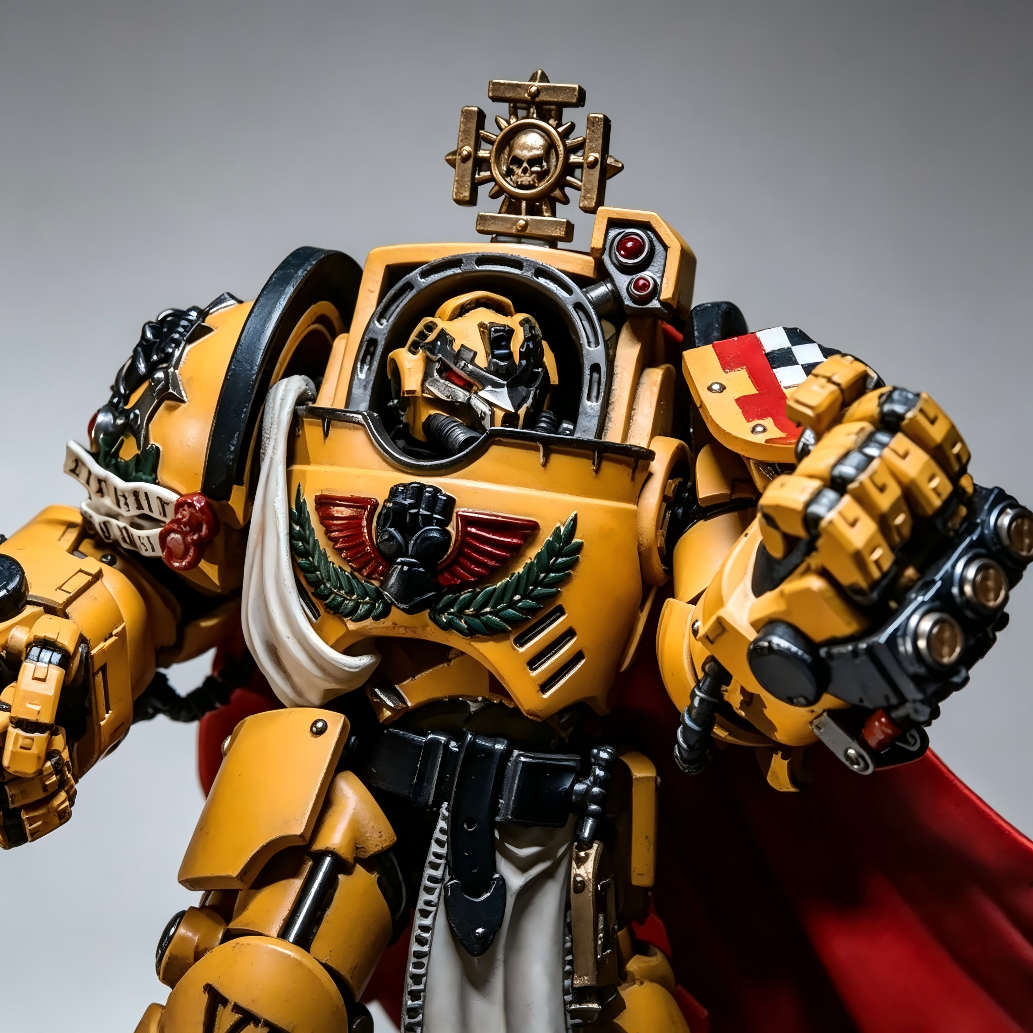 Close-up view of the Terminator Captain helmet, golden iron halo, and red-yellow checkerboard heraldic shield.