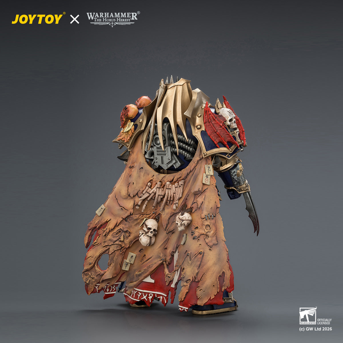 Three-quarter side angle view of the JOYTOY Warhammer 40K Konrad Curze action figure, emphasizing the crimson bat-wing pauldron design and the cinematic tattered crimson cape.
